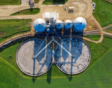 pexels-photo-10262730-10262730 Drone shot capturing modern silos in a vibrant green field in Randolph, MN.
